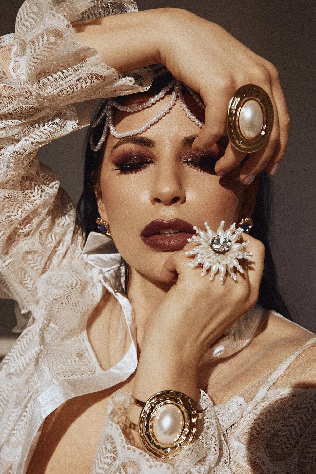 Close-up of a lace sleeve and statement ring