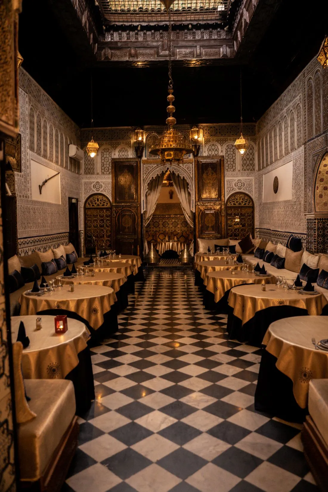Ornate dining hall with lanterns and arches